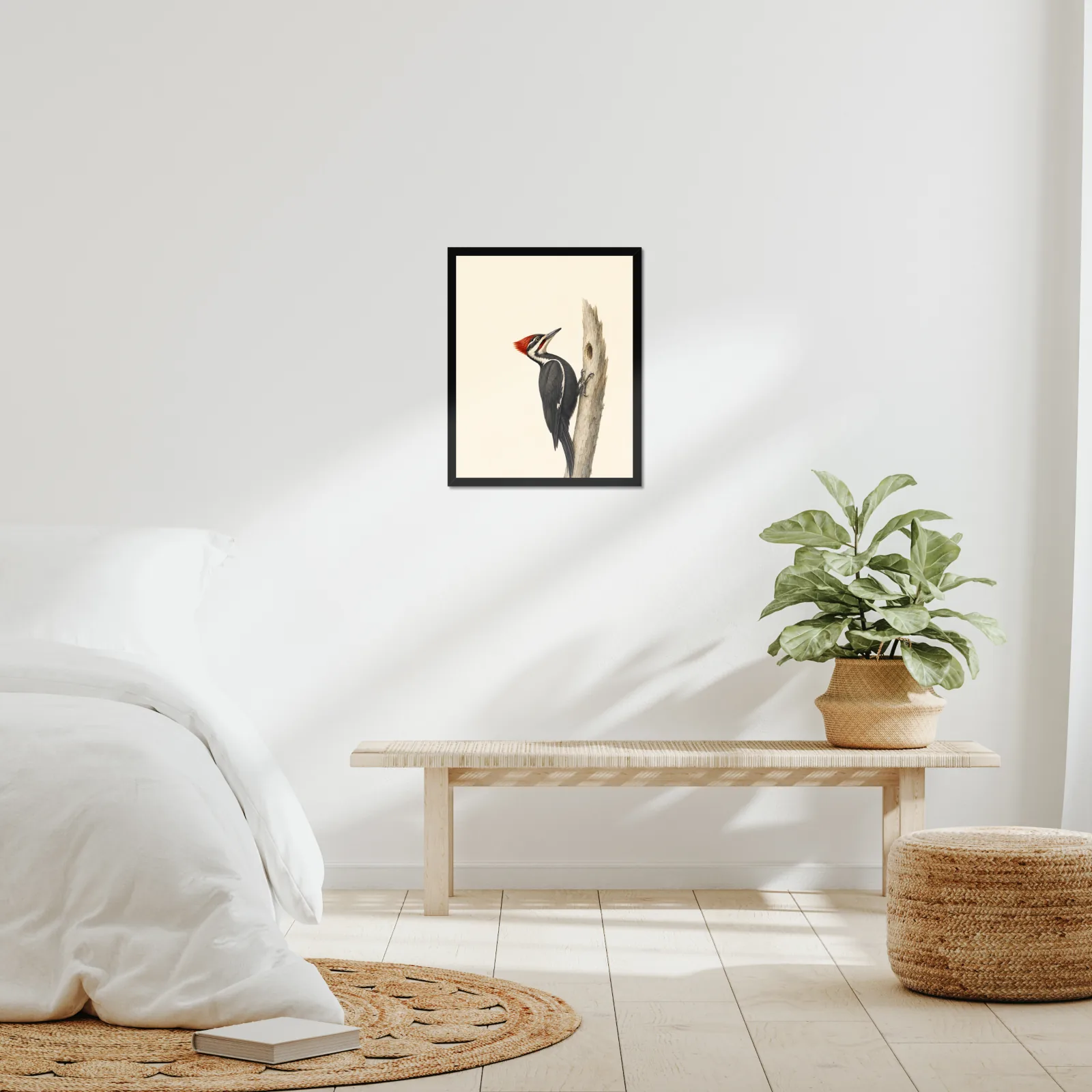 A framed Audubon-style print hung in a real room